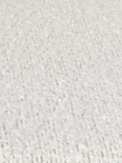Fauteuil lounge en tissu bouclé